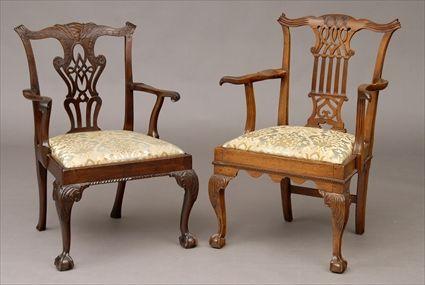 Appraisal: TWO GEORGE II CARVED MAHOGANY OPEN ARMCHAIRS The one with