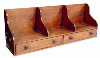 Appraisal: An early th century mahogany bookstand with three compartments shaped