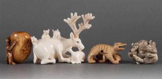 Appraisal: Four Japanese carved ivory animal-form netsukes figures include deer with