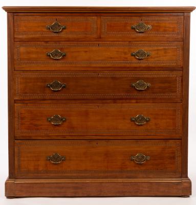 Appraisal: An Edwardian walnut chest of two short over four long