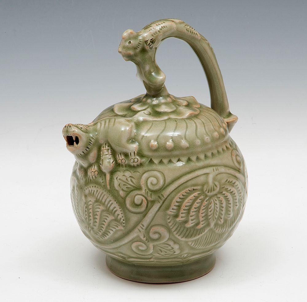 Appraisal: Carved Yaozhou Celadon Ewer Carved Yaozhou Celadon Ewer The well-potted