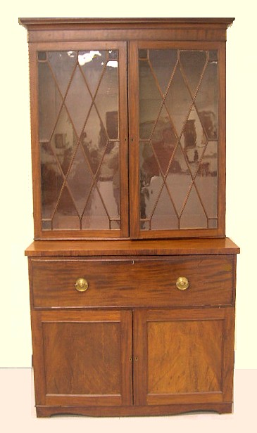 Appraisal: Bookcase desk mahogany and mahogany veneer th C elements appears