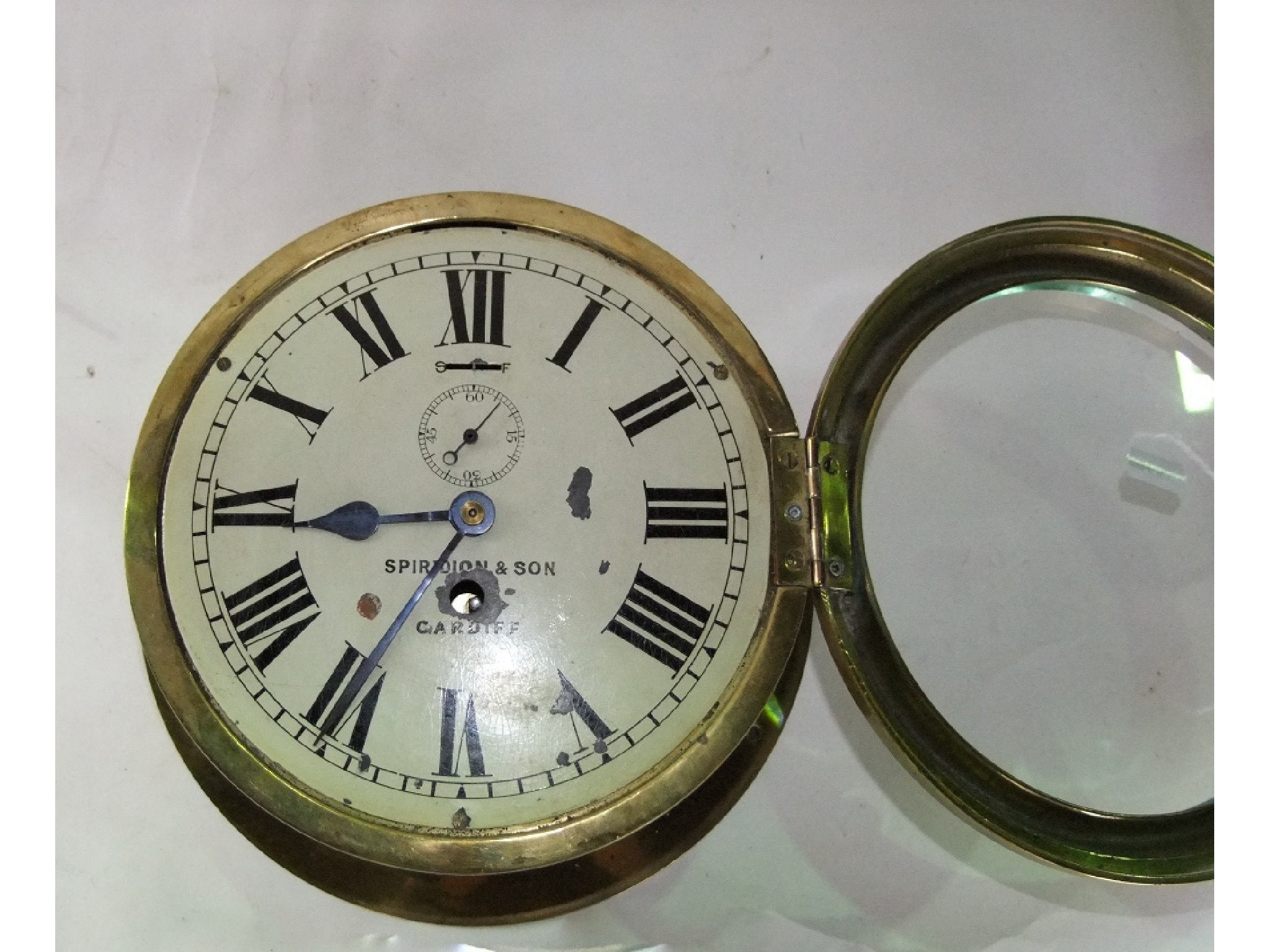 Appraisal: A good marine bulkhead timepiece with painted dial with subsidary