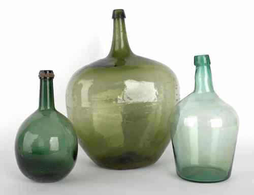 Appraisal: Three blown glass demijohn bottles th c tallest - h