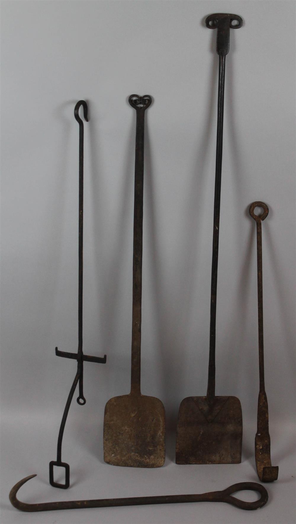 Appraisal: GROUP OF ASSORTED HANDFORGED FIRETOOLS the longest of two shovels