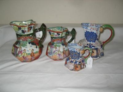 Appraisal: TWO VICTORIAN DAVENPORT IRONSTONE HYDRA JUGS of octagonal form printed