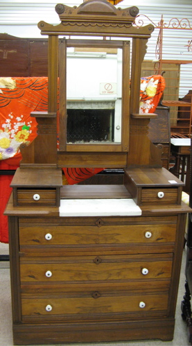 Appraisal: VICTORIAN WALNUT DRESSER American late th century the three-drawer chest