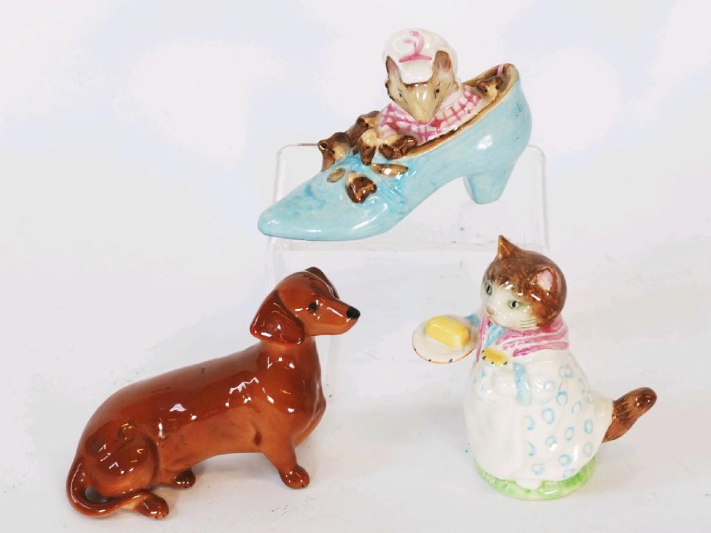 Appraisal: TWO BESWICK BEATRIX POTTER MODELS COMPRISING 'The Old Woman who