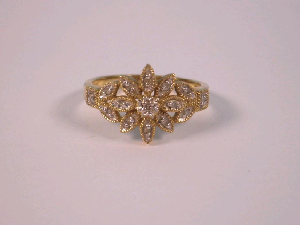 Appraisal: A floral shape dress ring set with tiny diamonds in