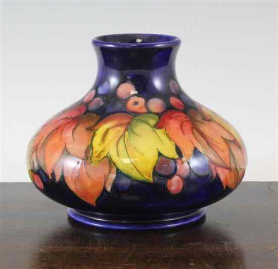 Appraisal: A Moorcroft Grape and Leaf pattern squat baluster vase c