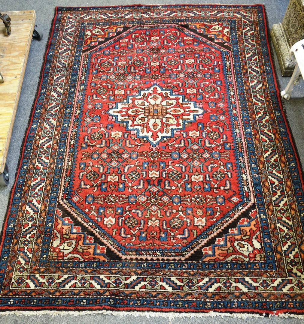 Appraisal: A Mahal rug Persian the madder herate field with an