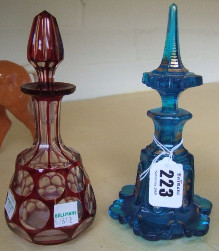 Appraisal: A Victorian ruby flashed glass scent bottle and stopper and