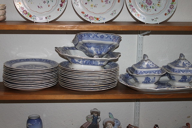 Appraisal: A CORONA WARE WILLOW PATTERN DINNER SERVICE including graduated meat