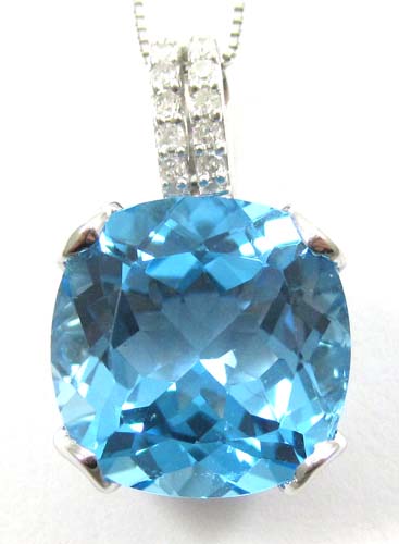 Appraisal: BLUE TOPAZ AND DIAMOND PENDANT NECKLACE suspended on an inch