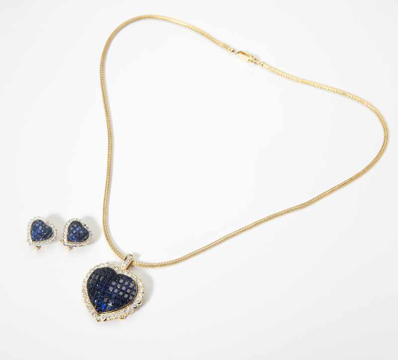 Appraisal: A sapphire diamond and gold heart pendant-brooch with matching earrings