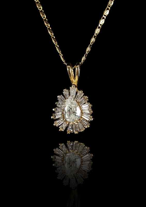 Appraisal: K DIAMOND PENDANT NECKLACE K yellow gold pendant contains one