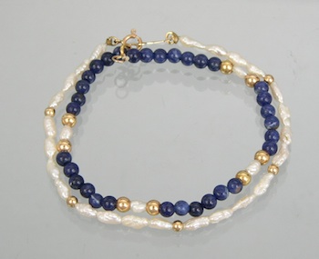 Appraisal: A Pair of Beaded Bracelets with Gold Pearl and Lapis