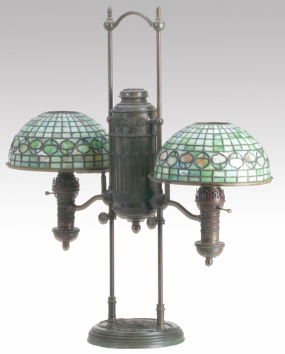 Appraisal: TIFFANY STUDIOS Double armed bronze student lamp in a coiled