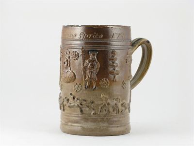 Appraisal: A large stoneware hunting mug Vauxhall sprigged with a bust