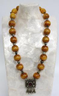 Appraisal: Bakelite Silver The large chunky amber-colored beads interspersed with small