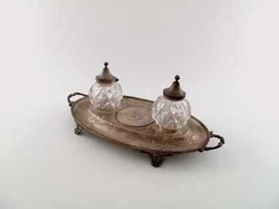 Appraisal: A Victorian engraved inkstand with openwork feet twin handles and