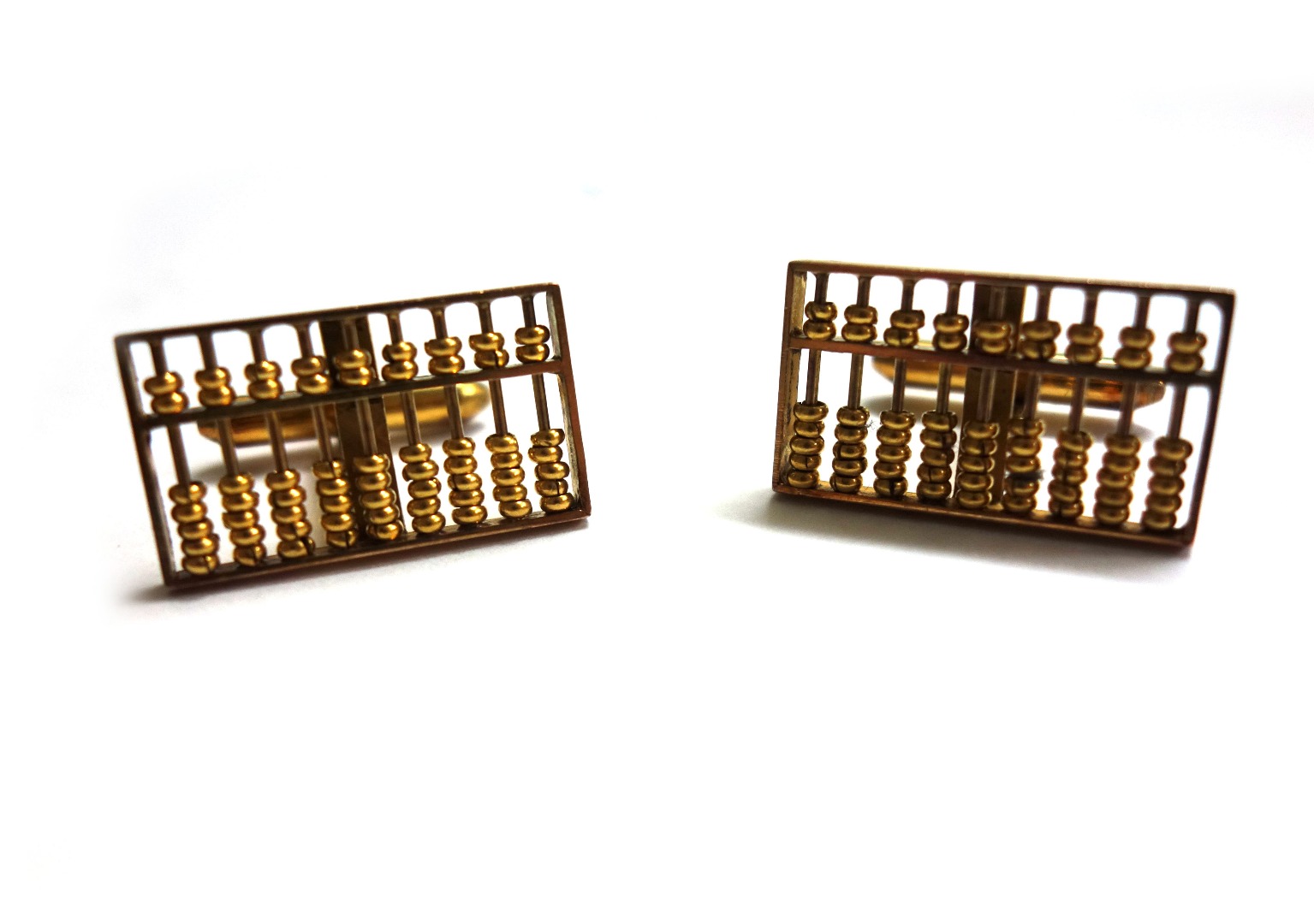 Appraisal: A pair of Continental yellow precious metal 'abacus' cufflinks each