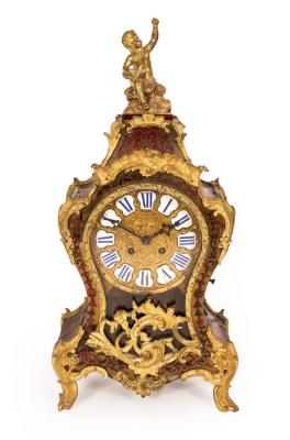 Appraisal: A Boulle type eight-day mantel clock in a tortoiseshell and