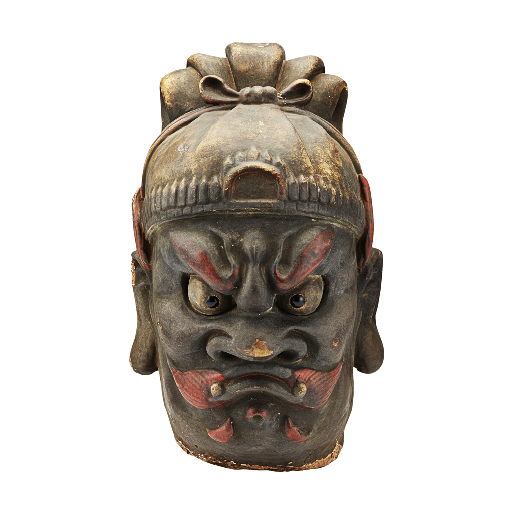 Appraisal: PAINTED EARTHENWARE HEAD OF A TEMPLE GUARDIAN modelled with ferocious