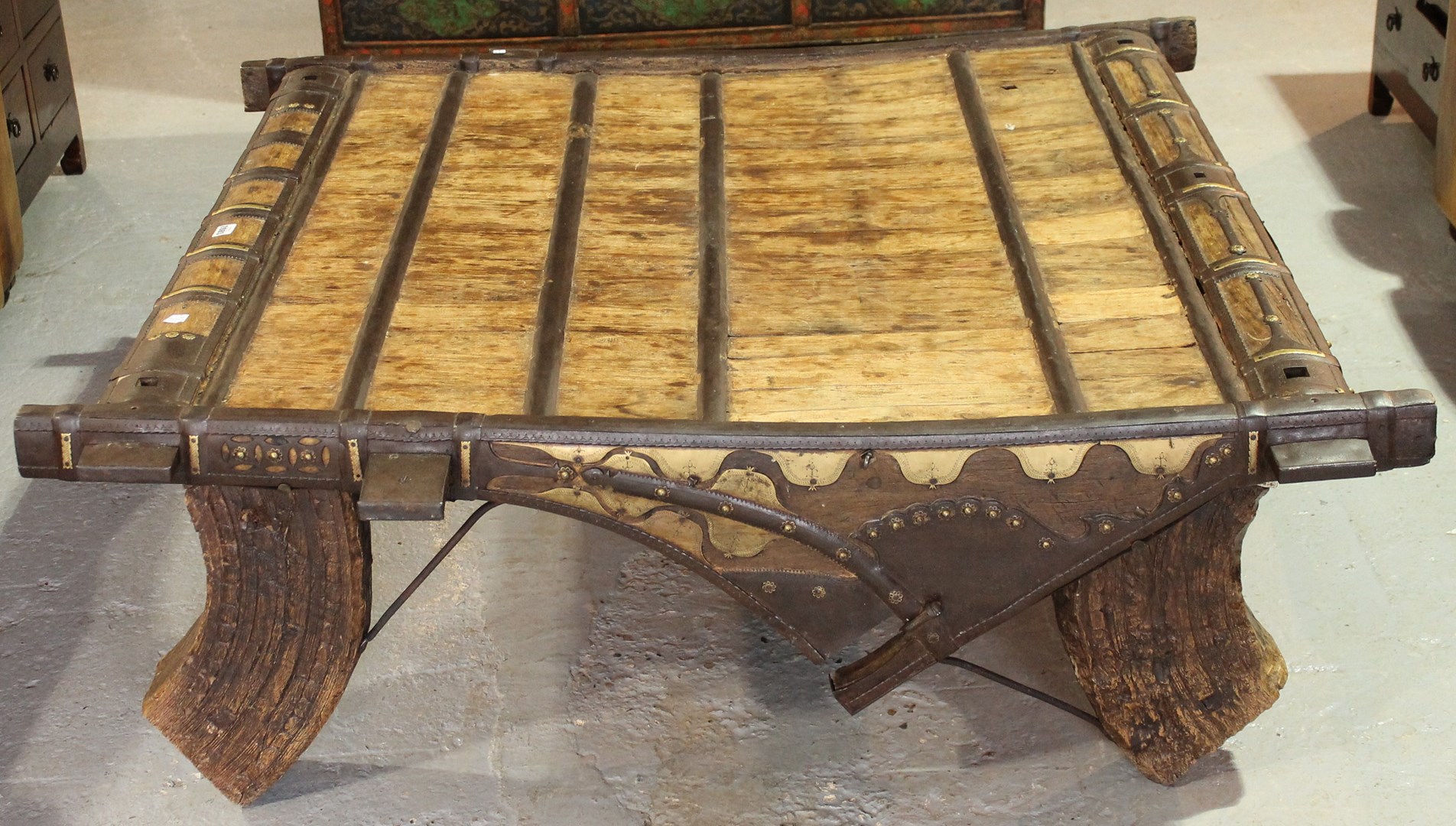 Appraisal: A th century iron bound hardwood coffee table elephant saddle