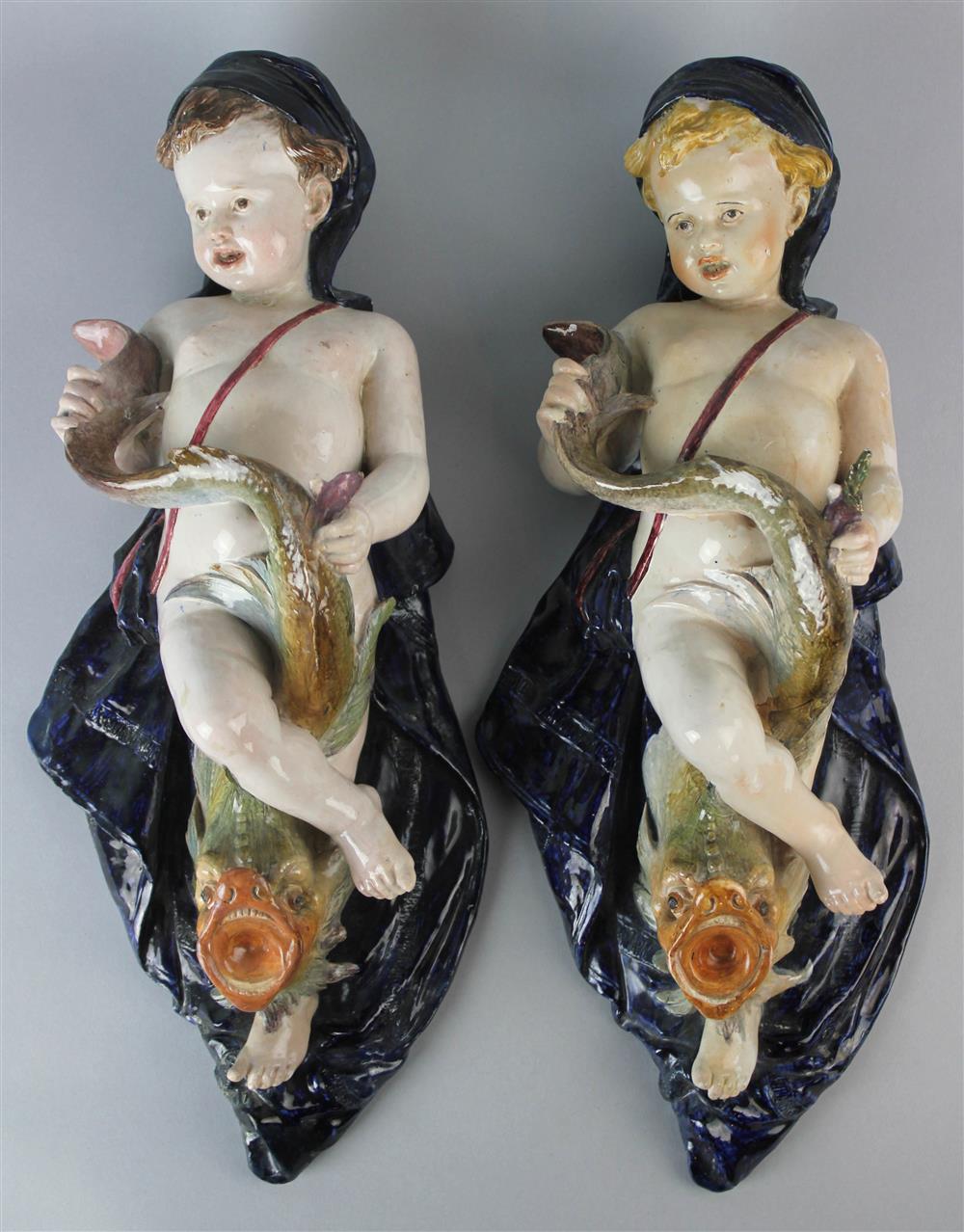 Appraisal: TWO GINORI MAGOLICA SEA BABY SCONCES blue Ginori mark and