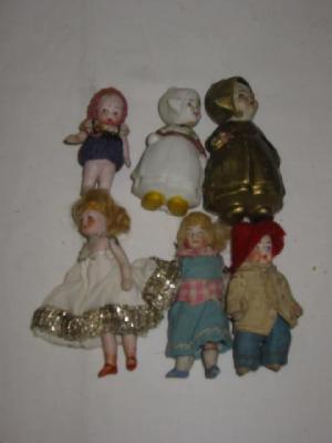 Appraisal: Four all bisque dolls house dolls with painted faces -