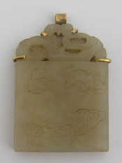 Appraisal: A yellow metal tests gold mounted Persian jade pendant approx