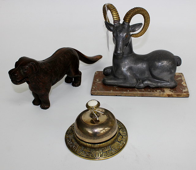 Appraisal: A BRASS DESK BELL together with a cast metal nutcracker