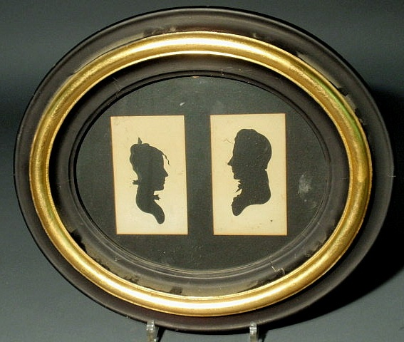 Appraisal: Pair of marriage silhouettes mounted in an oval frame and