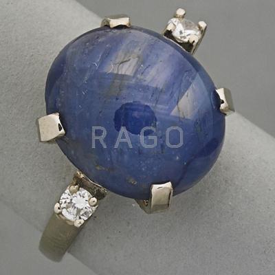 Appraisal: K GOLD STAR SAPPHIRE AND DIAMOND RING ca Oval blue