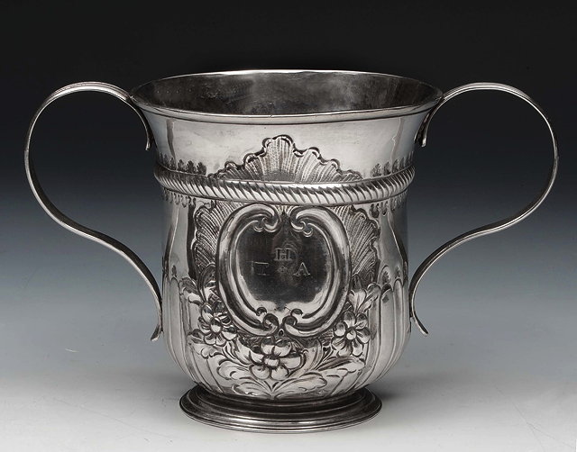 Appraisal: A GEORGE III SILVER TWO HANDLED CUP baluster shaped with