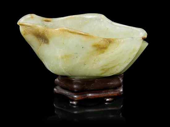 Appraisal: A Jade Lotus Form Brushwasher of celadon colored stone with