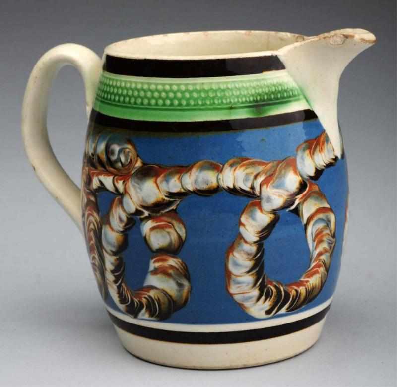 Appraisal: Outstanding Miniature Mochaware Creamer English Reticulated green-decorated band and large