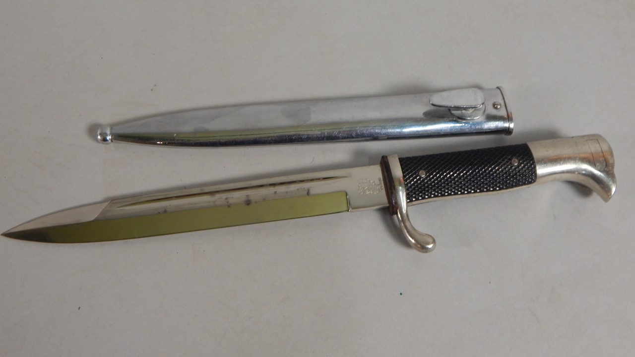 Appraisal: A Third Reich German Officer's bayonet with plated scabbard and