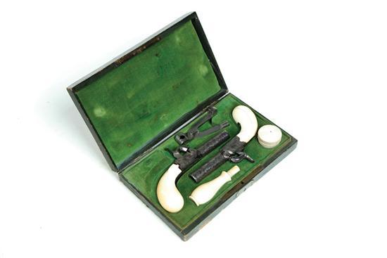 Appraisal: CASED PAIR OF PERCUSSION PISTOLS WITH IVORY GRIPS AND ACCESSORIES