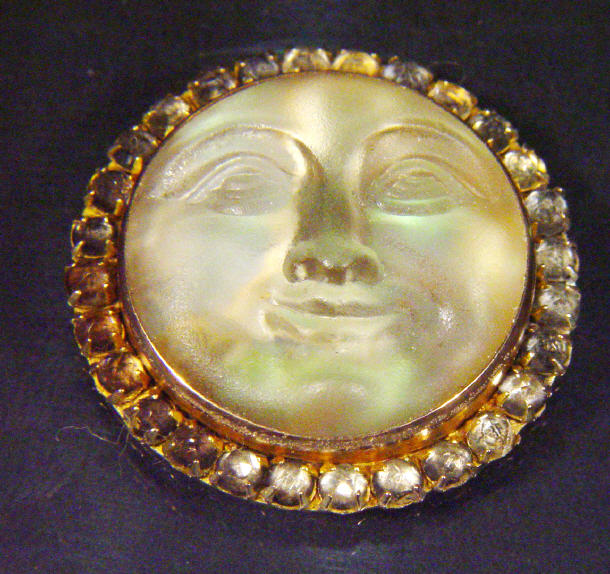 Appraisal: Glass moon face brooch no pin