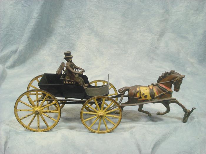 Appraisal: Cast iron toy horse drawn open carriage cart with removable