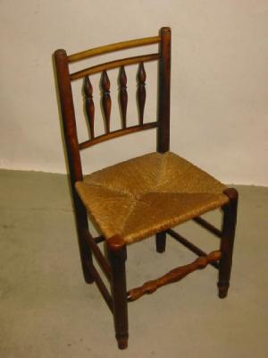 Appraisal: A SET OF FOUR ASH COUNTRY CHAIRS with rush seats