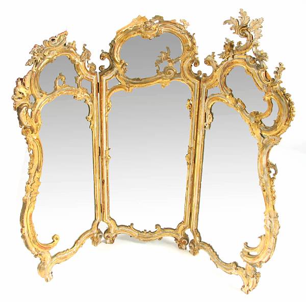 Appraisal: A Rococo style giltwood and mirrored three fold floor screen