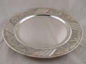 Appraisal: An Italian grade silver dish the broad rim embossed with