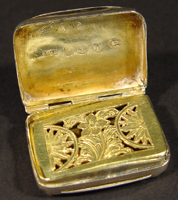 Appraisal: Georgian rectangular silver vinaigrette with gilt interior and chased decoration