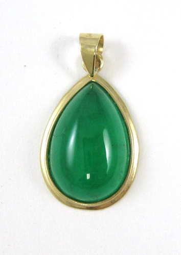 Appraisal: JADE AND FOURTEEN KARAT GOLD PENDANT set with a pear