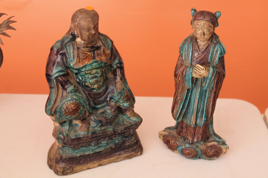 Appraisal: A Chinese blue glazed Buddha and a figure of an