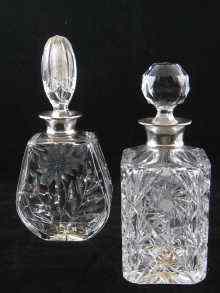 Appraisal: Two silver mounted cut glass decanters one measuring approx cm