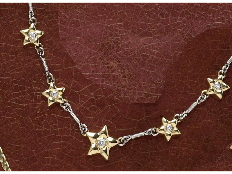 Appraisal: DIAMOND STAR NECKLACE k yellow gold stars set with seven